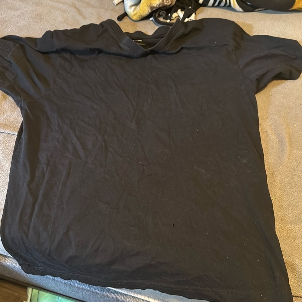 Black T-shirt it’s medium. It’s good for any occasion.